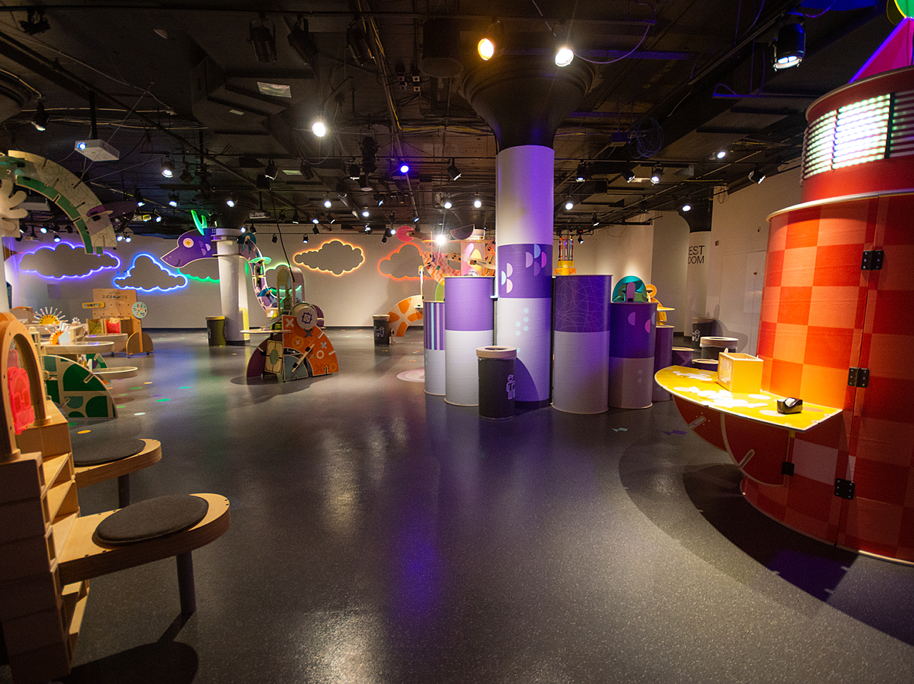Hallmark Kaleidescope children's art display featuring a lighthouse and other colorful art stations in a large open space