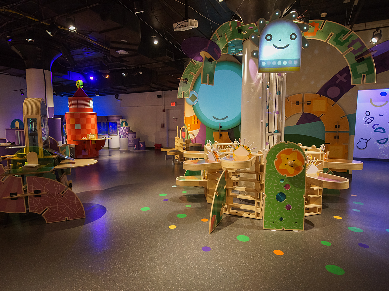 Hallmark Kaleidoscope children's exhibit featuring a wooden, circular tower with whimsical designs and Crayola markers.