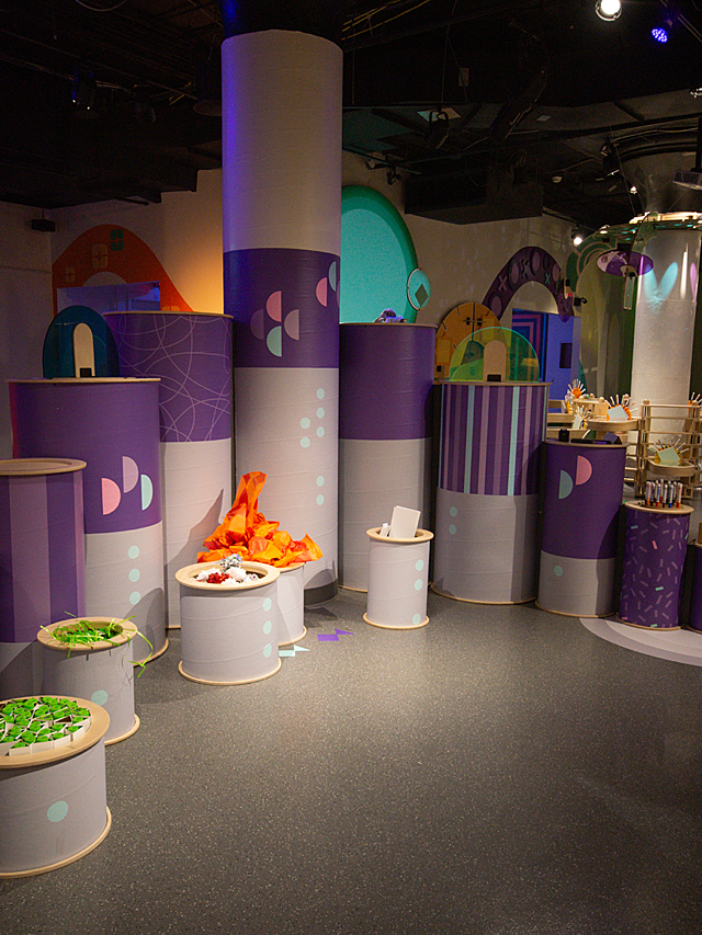 Hallmark Kaleidoscope children's exhibit with tall purple towers and bins of various materials to create art projects