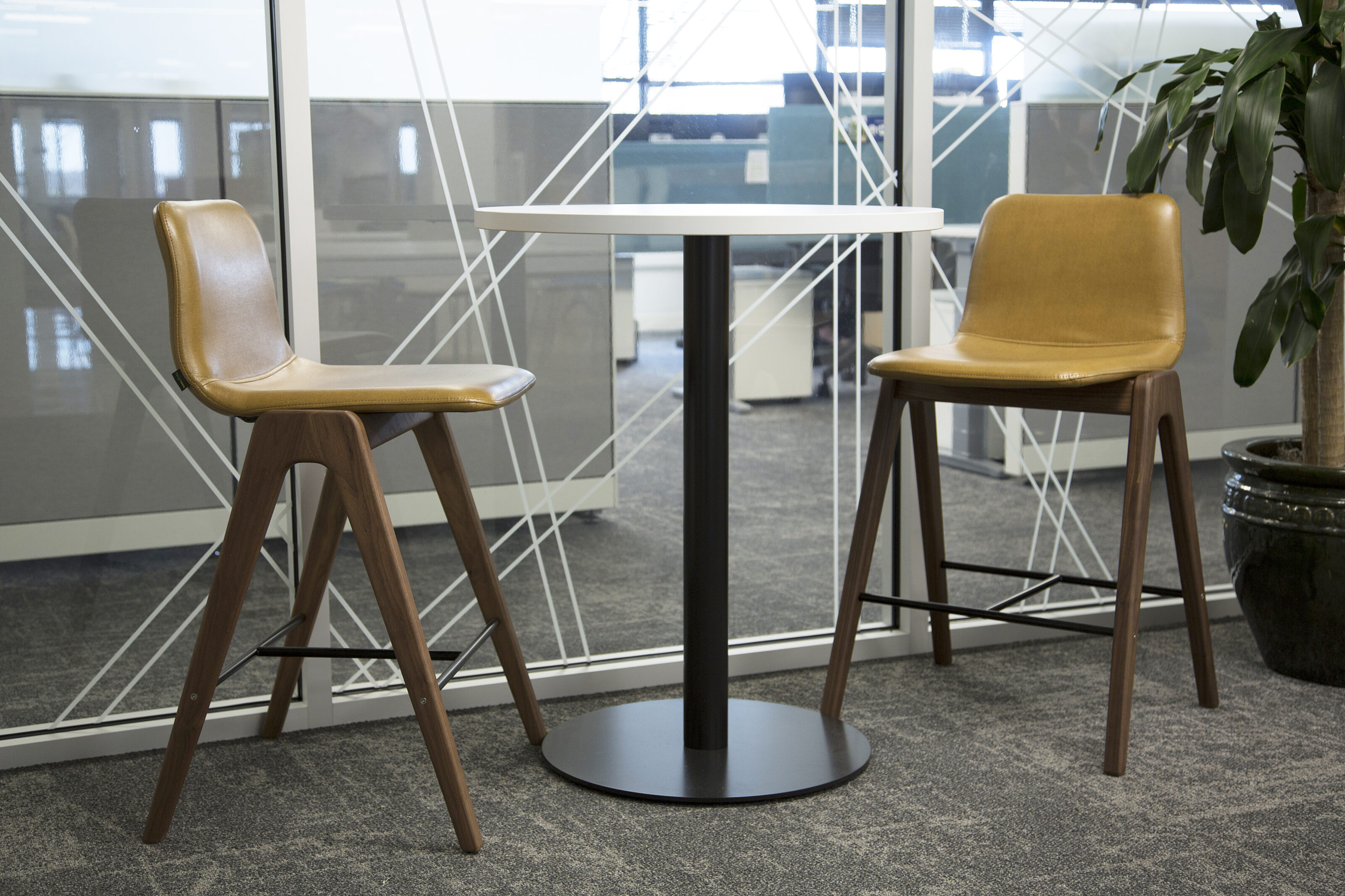 Lockton Affinity  - bar height cafe table and stools with wooden hairpin lets and brown leather seats.